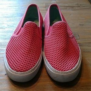 Bright pink slip ons